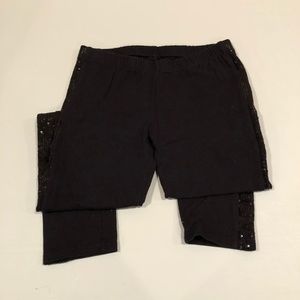 Girls black leggings with sequined trim.